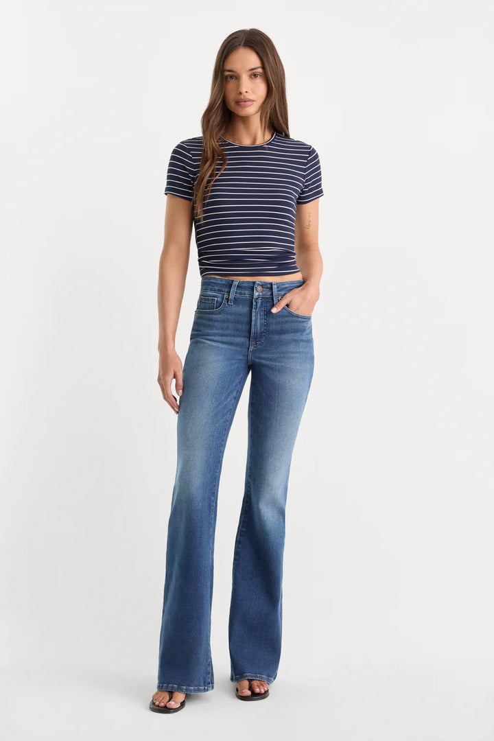 good american good legs soft tech flare jeans mid-rise with navy and white stripe tee black flip flops indigo133 dark wash