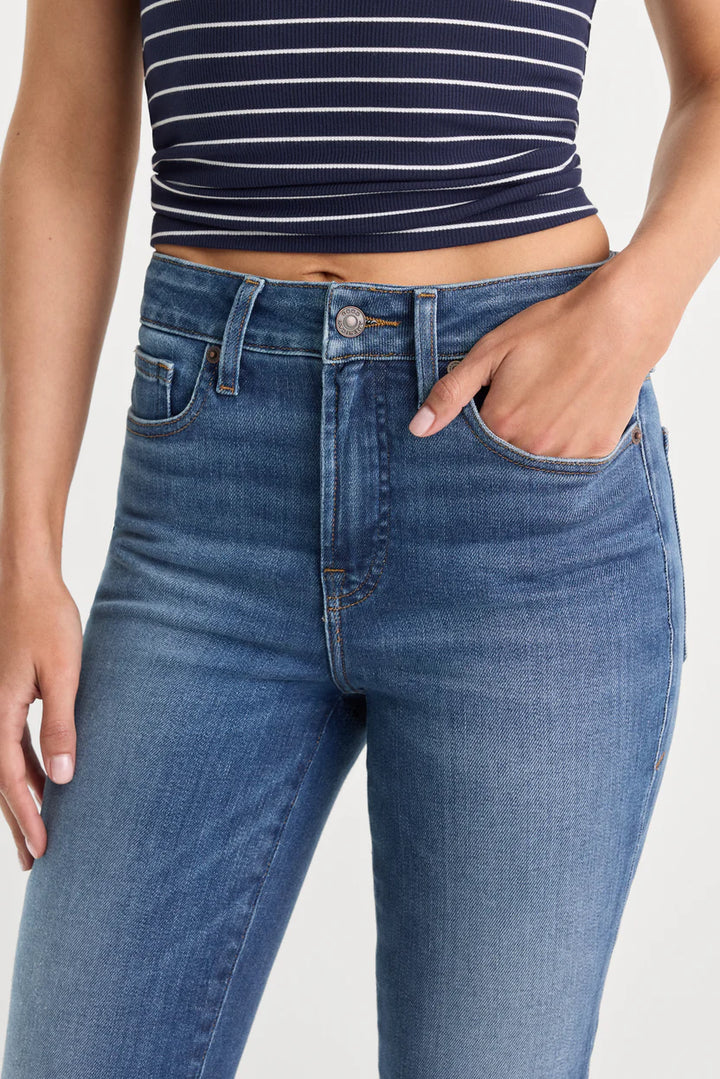 good american good legs soft tech flare jeans mid-rise with navy and white stripe tee black flip flops indigo133 dark wash