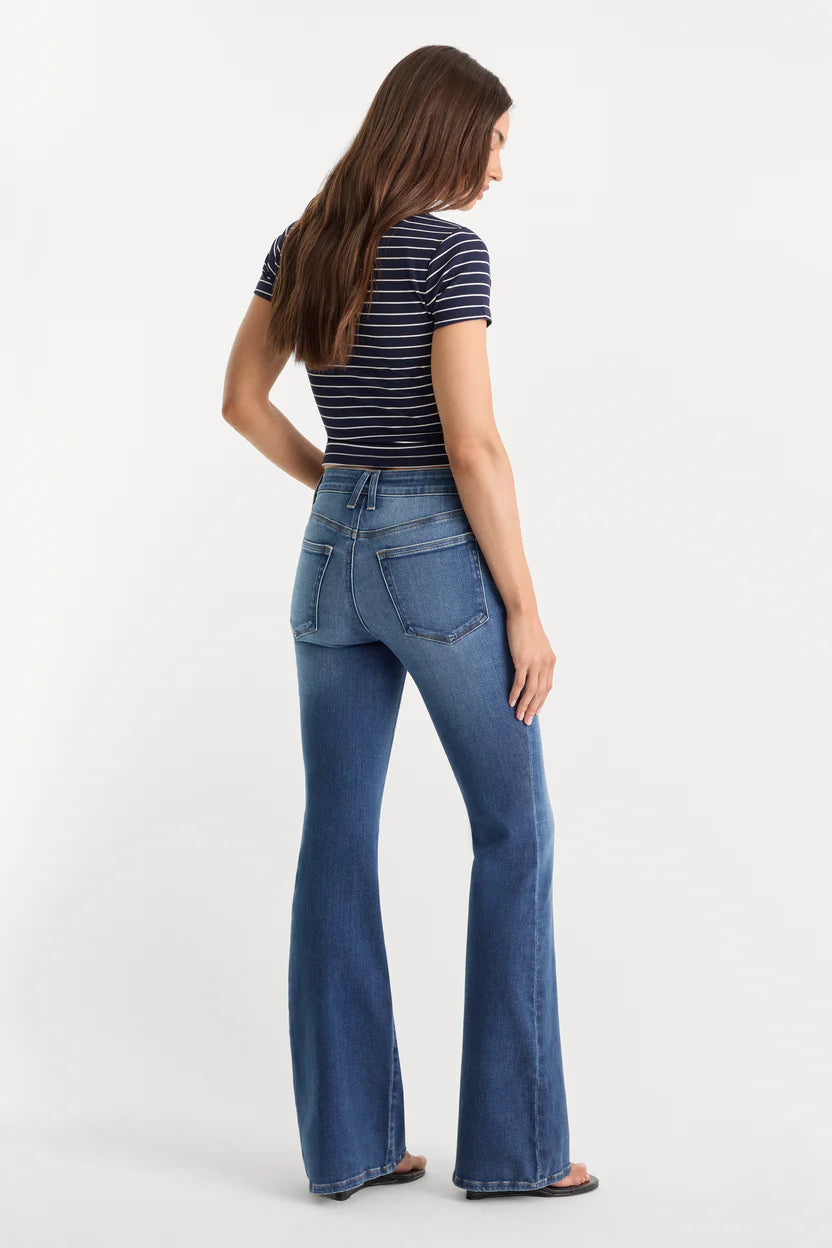 good american good legs soft tech flare jeans mid-rise with navy and white stripe tee black flip flops indigo133 dark wash