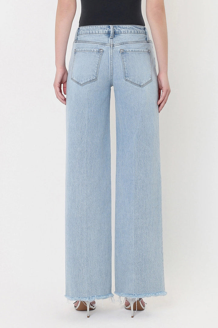 vervet Olivia High rise wide leg trouser crease seam frayed raw hem with black tank and silver strappy kitten heel sandals