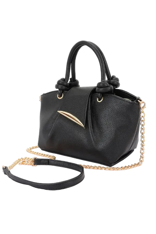Black textured faux leather top handle handbag with gold chain and accents on a white background