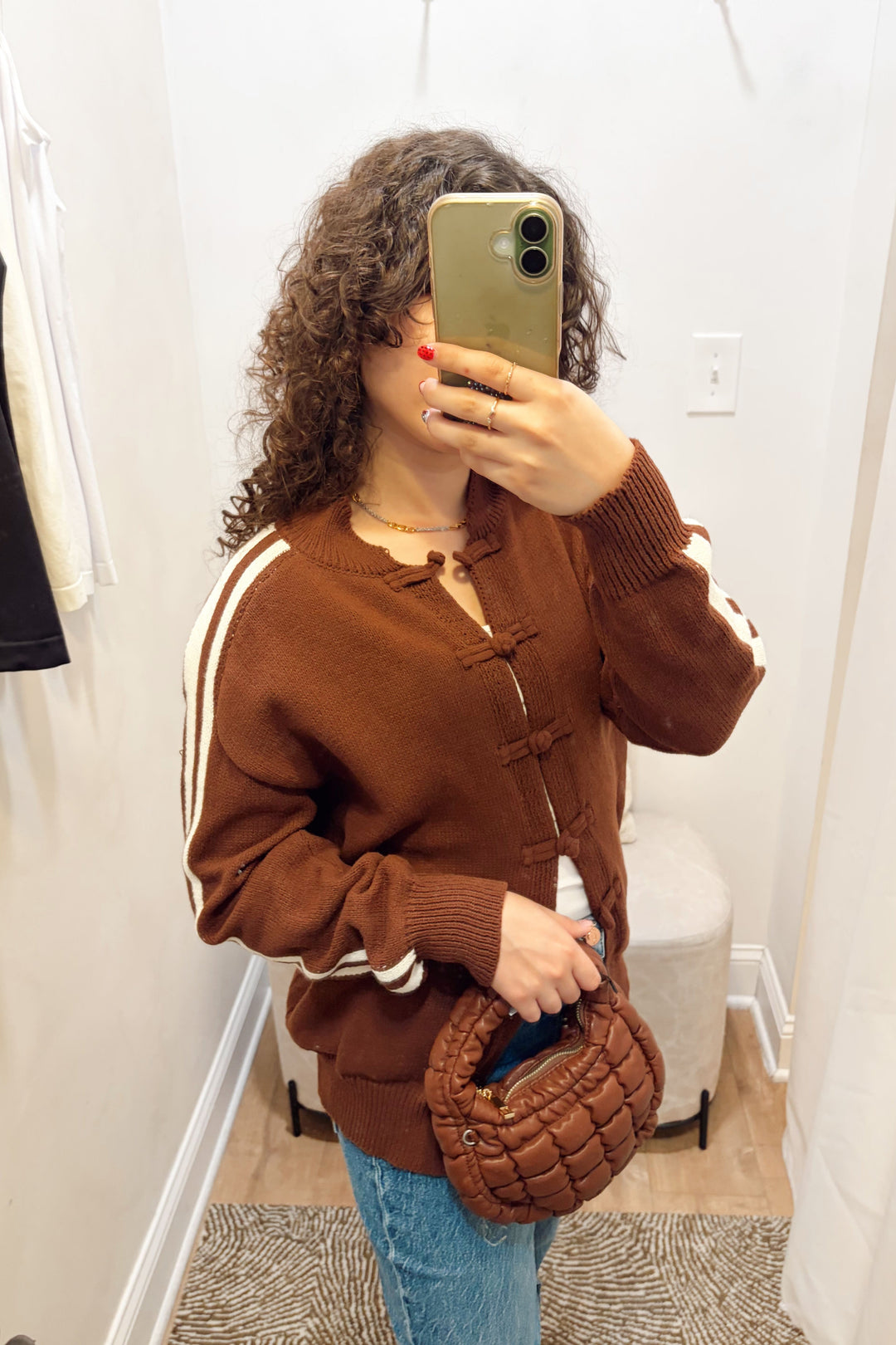 Stanton Dazed white Stripe brown Cardigan long sleeve ribbed knit long length with denim jeans and a brown quilted puffy bag.