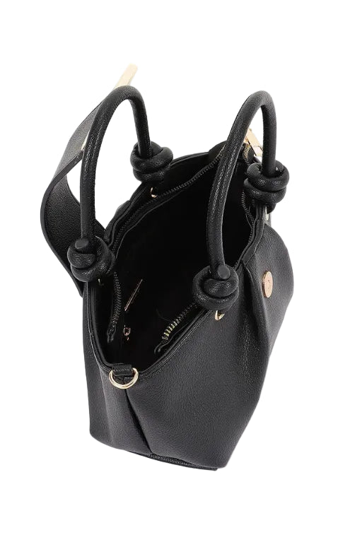 Black textured faux leather top handle handbag with gold chain and accents on a white background