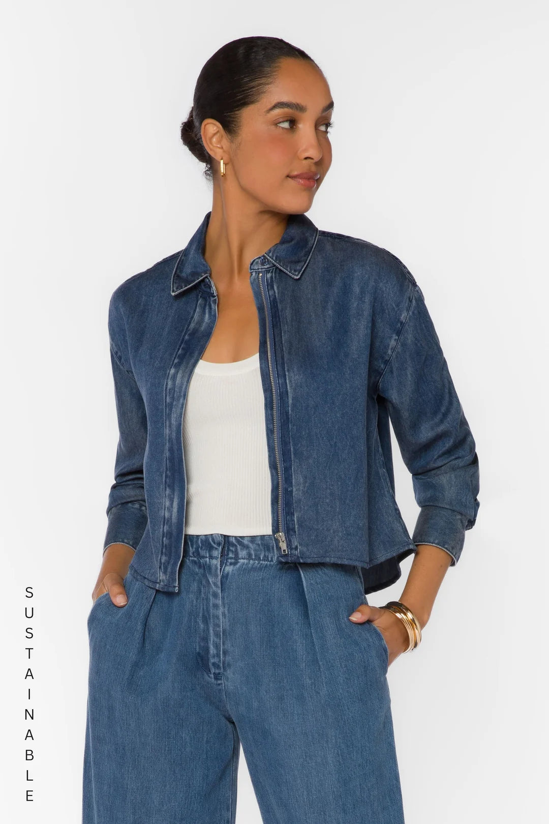 velvet Heart Thea long sleeve zip up denim shirt Shacket over a white tank top with denim pleated pants