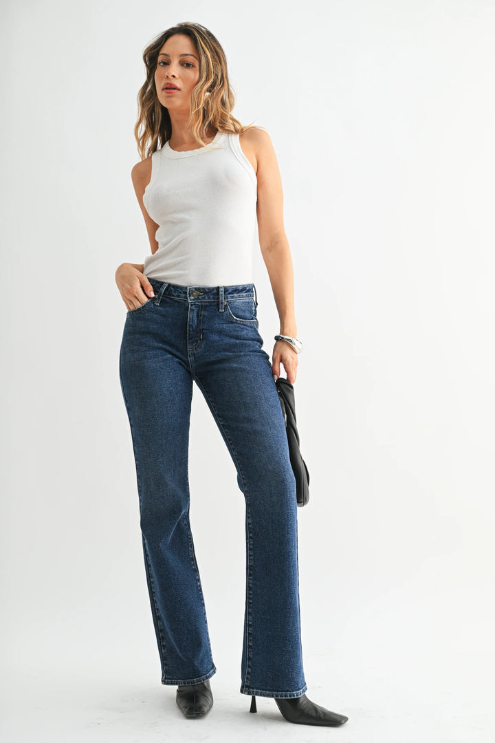 just Black the Low Rise Bootcut jean dark denim with black booties and a white tank top
