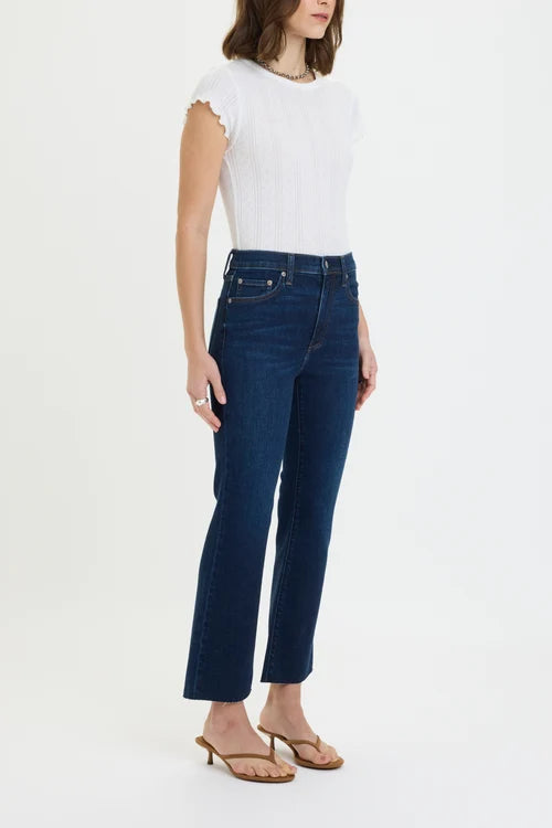 daze denim shy girl high rose crop flare jeans in a dark wash with a white short sleeve shirt and brown sandals