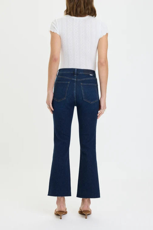 daze denim shy girl high rose crop flare jeans in a dark wash with a white short sleeve shirt and brown sandals
