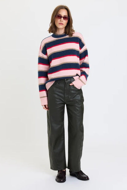 daze denim high rise barrel jeans in a coated Fern dark green color with a striped multicolor sweater and loafers