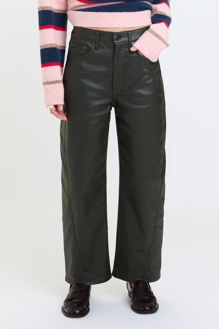 daze denim high rise barrel jeans in a coated Fern dark green color with a striped multicolor sweater and loafers