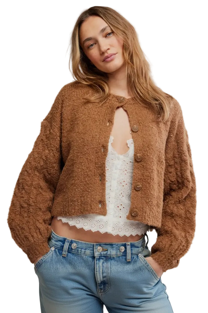 FREE PEOPLE THISTKE cropped, fuzzy brown button-front cardigan over a white lace-trim camisole and blue jeans, photographed against a plain white background