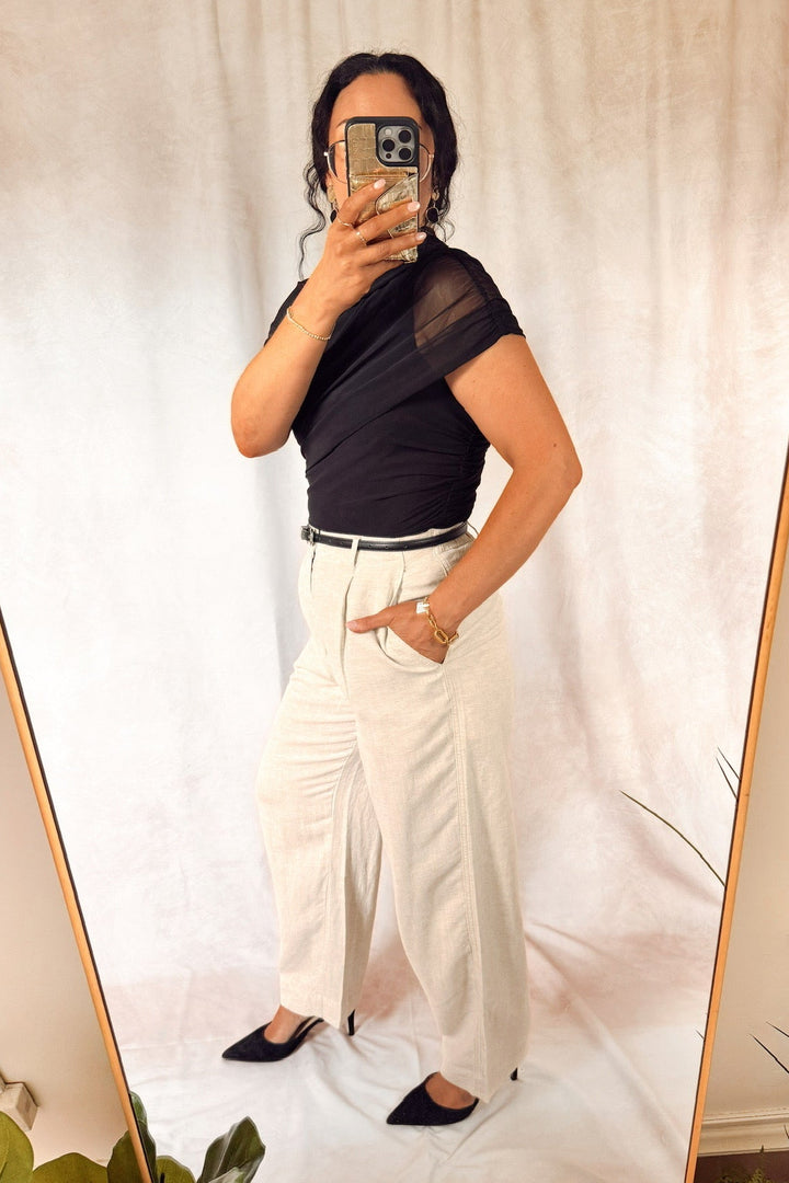 heartloom rumer pants natural beige with teve Madden layered ruch Kerry top black with black heels and a slim leather black belt 