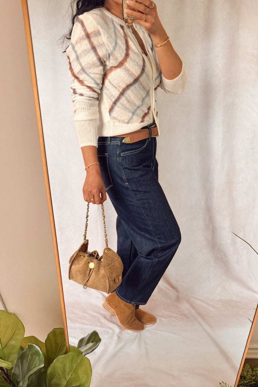 free people highland mist button front long sleeve cardigan sugar combo with dark wash barrel jeans and a quilted suede bucket bag