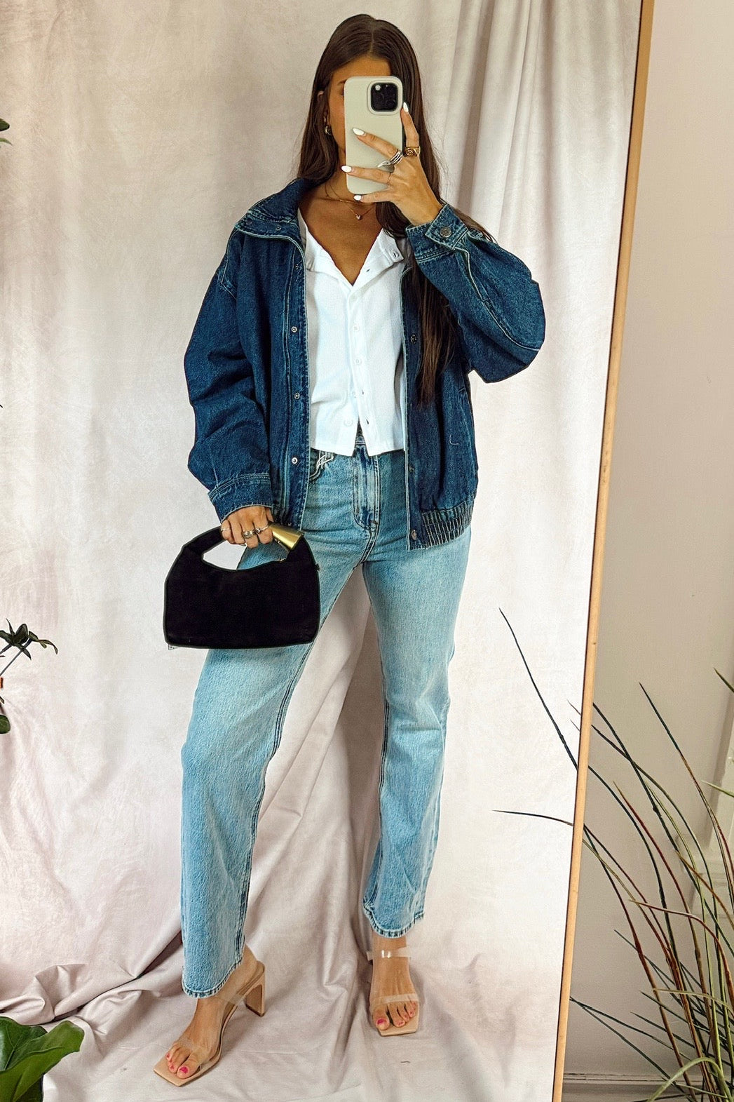 z Supply the Muse High Rise straight leg denim jean light Year wash with chaser brandy White button up long sleeve shirt and daze denim phantom dark wash jean jacket with a funnel neck paired with nude heels and a black faux suede bag