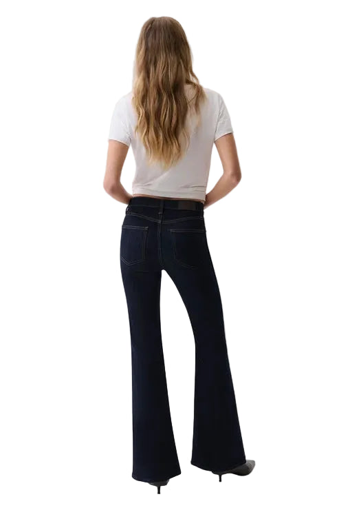 pistola denim Kinsley Mid Rise super stretchy dark Wash flare full length jean with a white tee and black pumps