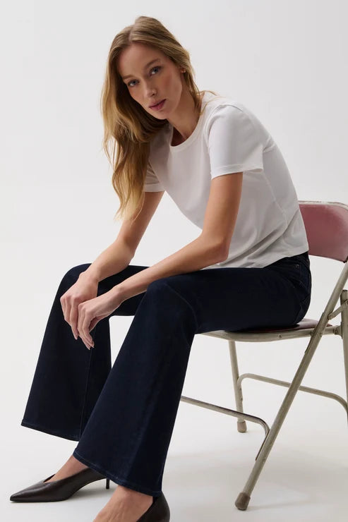 pistola denim Kinsley Mid Rise super stretchy dark Wash flare full length jean with a white tee and black pumps