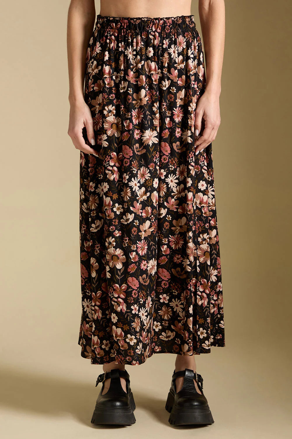 saltwater Luxe Ida midi skirt black with pink, off-white, and taupe floral print