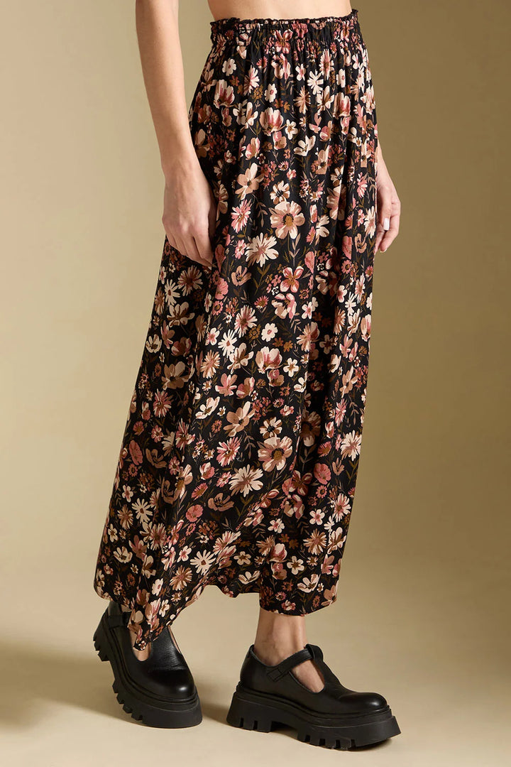 saltwater Luxe Ida midi skirt black with pink, off-white, and taupe floral print