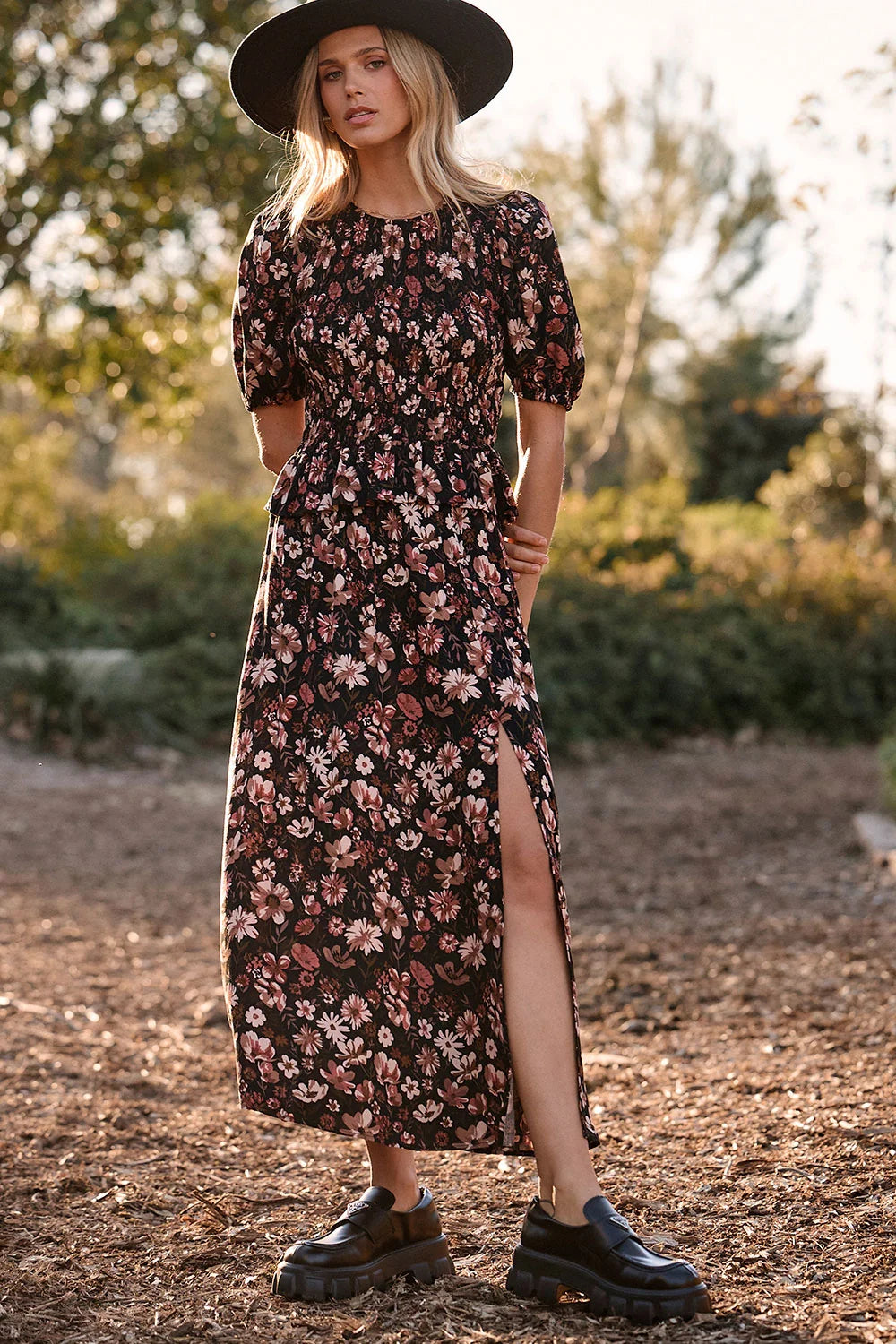 saltwater Luxe Tachi short puff sleeve smocked floral top with a ruffle trim hem and ida mida skirt with a side slit
