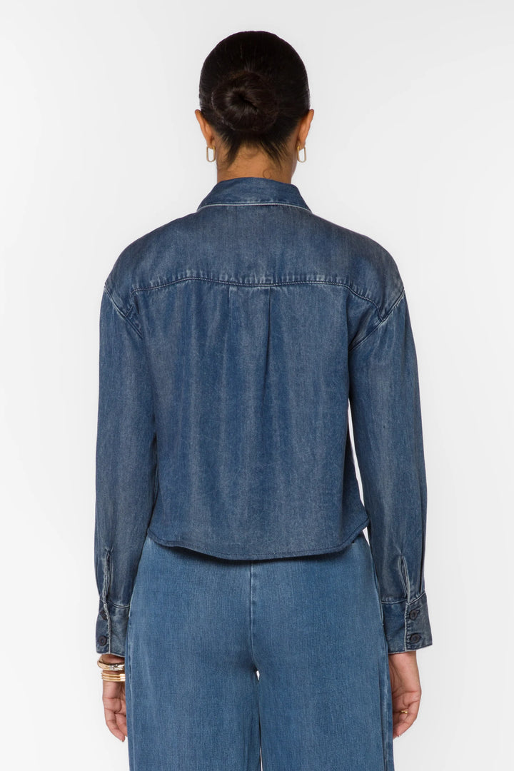 velvet Heart Thea long sleeve zip up denim shirt Shacket over a white tank top with denim pleated pants