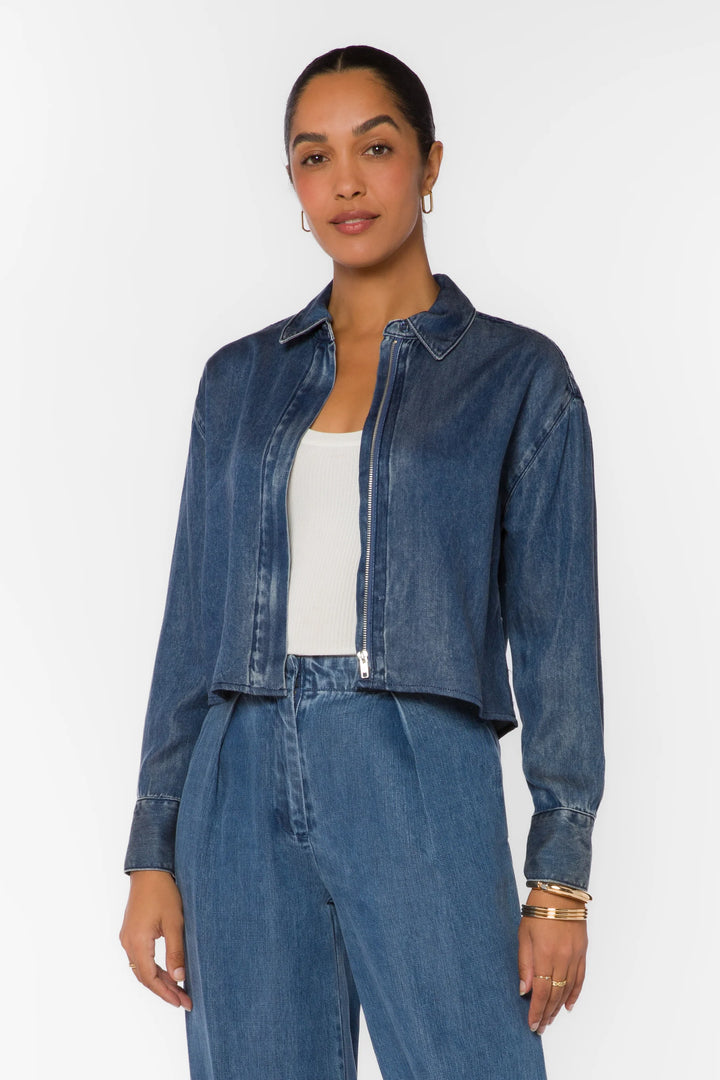 velvet Heart Thea long sleeve zip up denim shirt Shacket over a white tank top with denim pleated 
