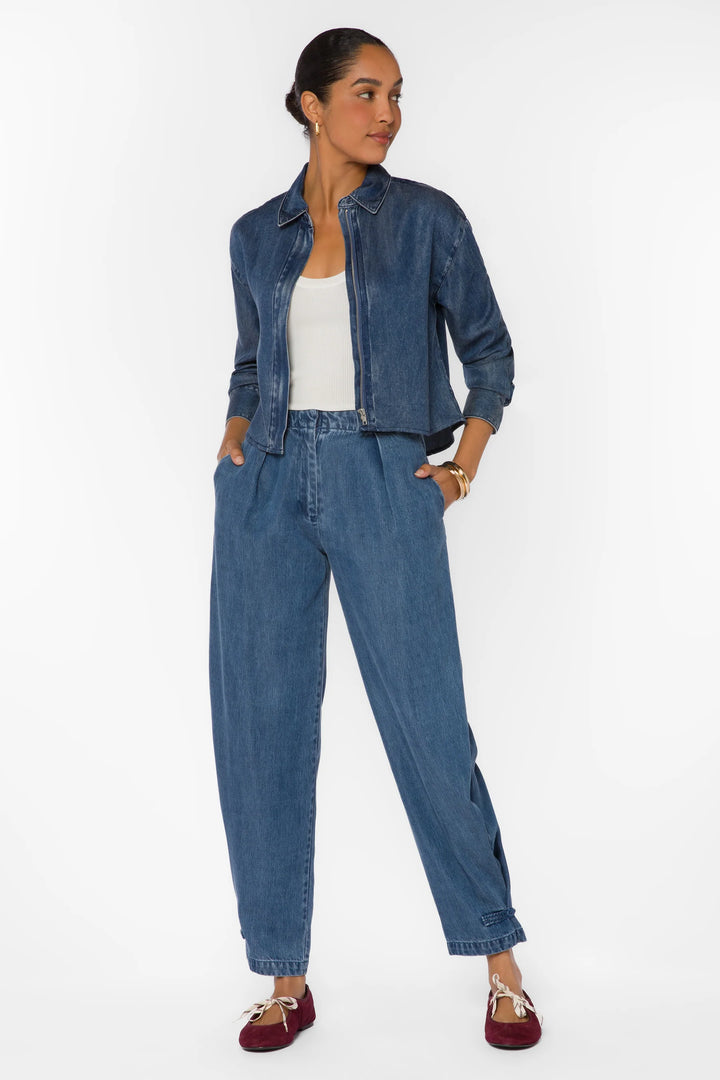 velvet Heart Thea long sleeve zip up denim shirt Shacket over a white tank top with denim pleated pants