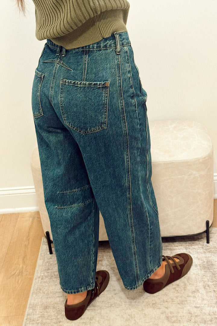 high rise dark wash wide leg barrel jeans slouchy with brown Mary Jane flats and a green ribbed short sleeve sweater