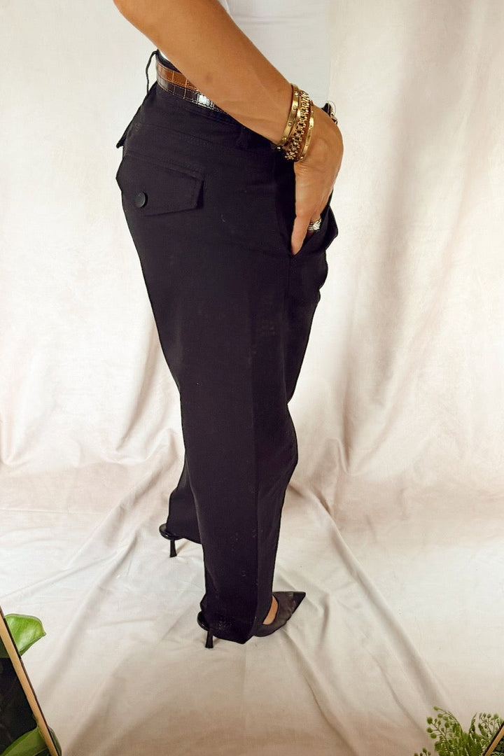 bevy Flog high rise pleated tapered trouser with a smooth white tank top and black heels and a two-tone leather croc glazed belt 