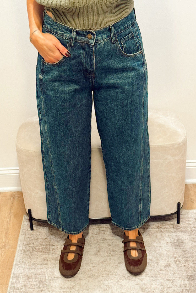 high rise dark wash wide leg barrel jeans slouchy with brown Mary Jane flats and a green ribbed short sleeve sweater