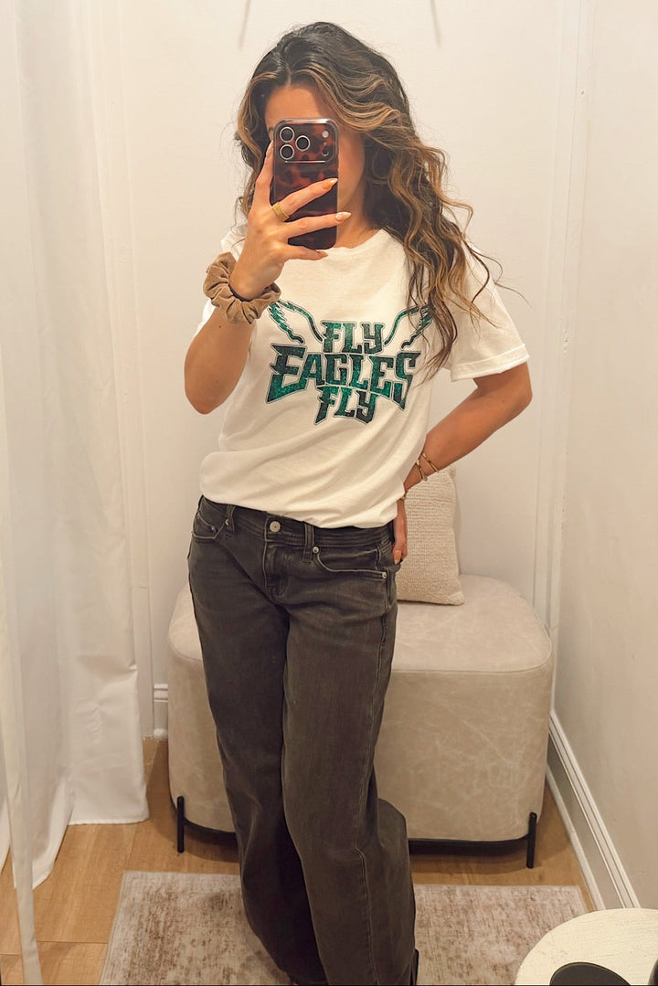 short sleeve crew neck T-shirt with "fly eagles fly" lettering in a glitter print Philadelphia eagles football gear merch apparel for women in south jersey