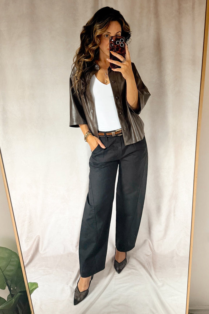 bevy Flog high rise pleated tapered trouser with a smooth white tank top and black heels and a two-tone leather croc glazed belt 