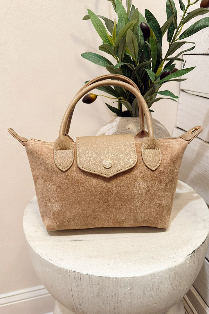 britney taupe faux suede cross body bag