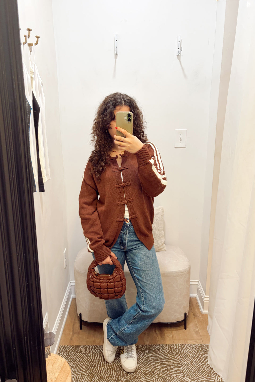 Stanton Dazed white Stripe brown Cardigan long sleeve ribbed knit long length with denim jeans and a brown quilted puffy bag.