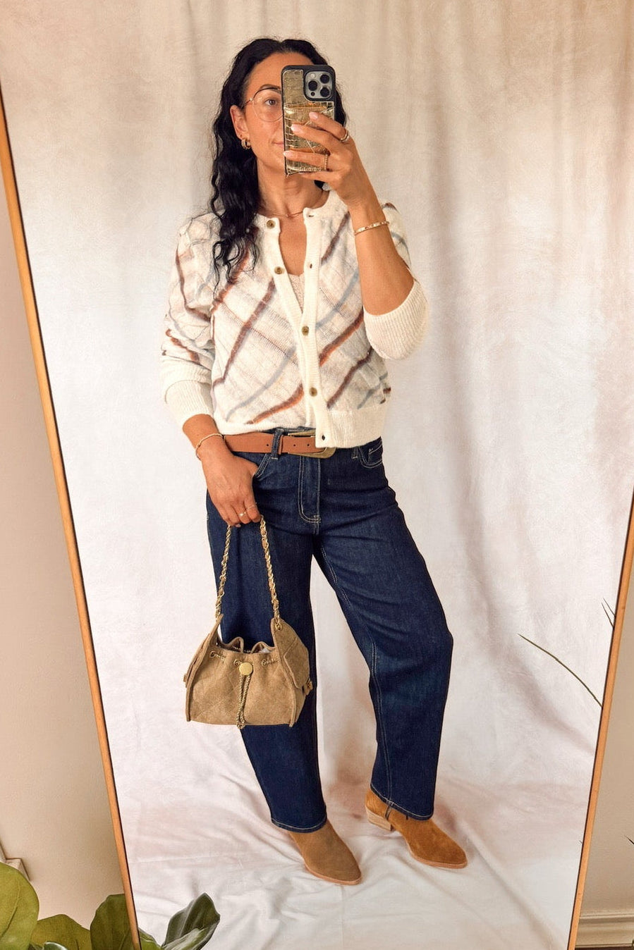 free people highland mist button front long sleeve cardigan sugar combo with dark wash barrel jeans and a quilted suede bucket bag