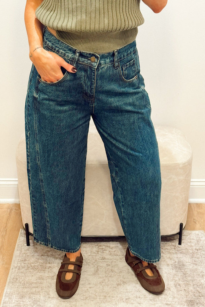 high rise dark wash wide leg barrel jeans slouchy with brown Mary Jane flats and a green ribbed short sleeve sweater