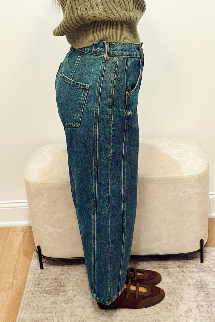 high rise dark wash wide leg barrel jeans slouchy with brown Mary Jane flats and a green ribbed short sleeve sweater
