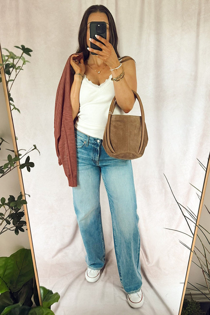 pistola harlowe relaxed baggy medium light wash jeans with z supply eve lace knit tank sandstone off white cream and a free people Barlow suede bucket bag 