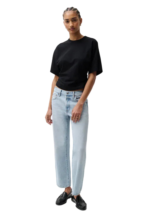pistola lexi mid rise bowed straight leg jeans in a light wash with a black t-shirt and black slip-on shoes