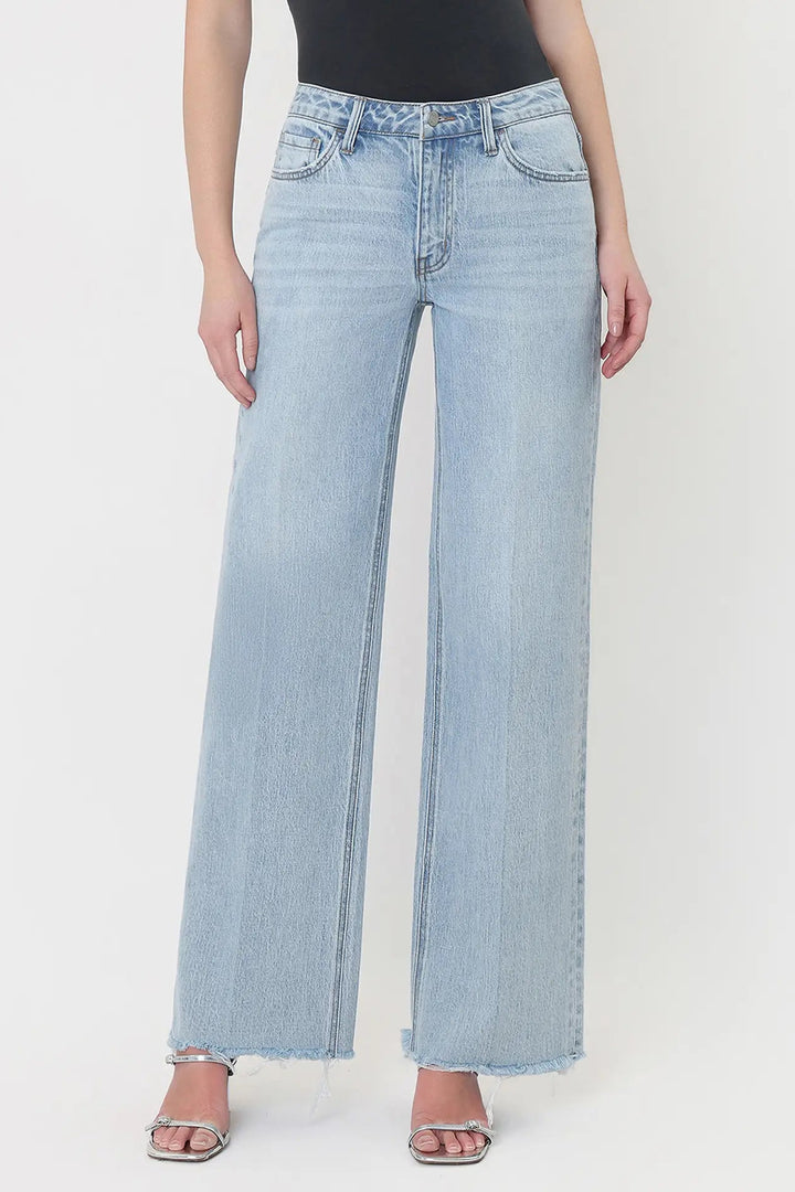 vervet Olivia High rise wide leg trouser crease seam frayed raw hem with black tank and silver strappy kitten heel sandals