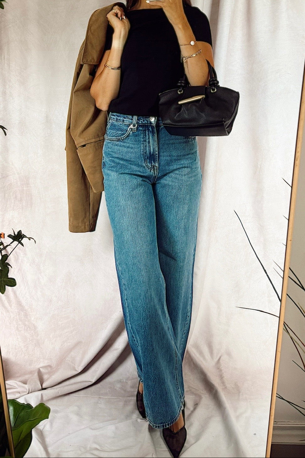 z supply The Head turner high rise wide leg denim jeans medium dark wash with a black off the shoulder top and a black handbag with a suede jacket over the shoulder from free people and black 